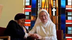 Sister Sebastiana Praying with a Friend in Chapel